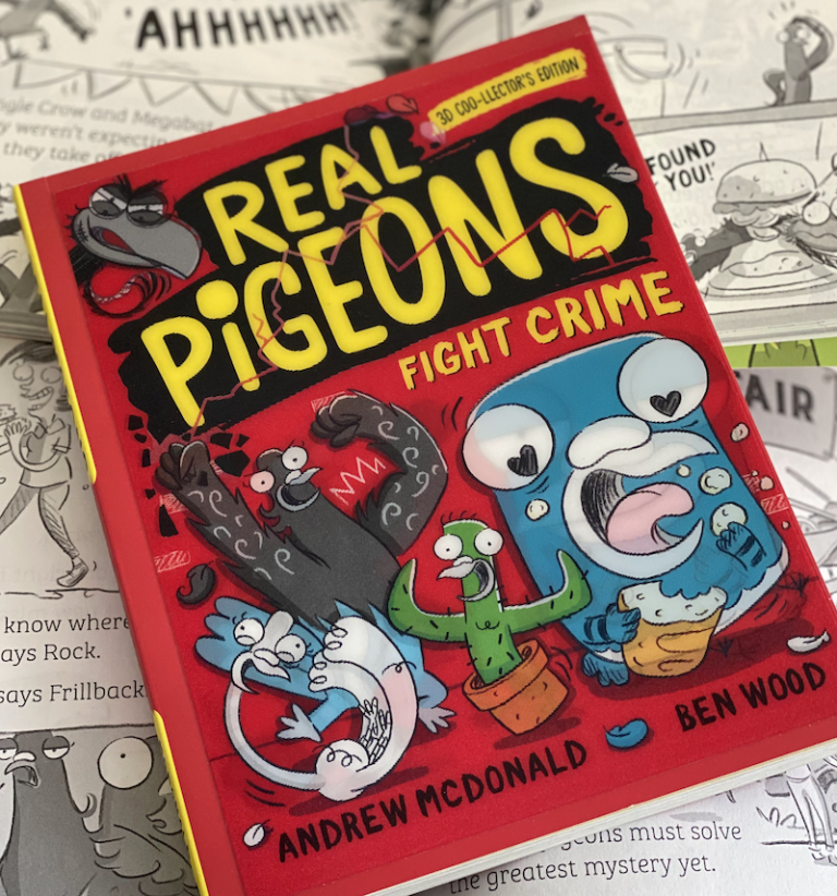 A photo of a book called 'Real Pigeons Fight Crime: 3D Coo-llector's Edition'. It sits on a pile of open versions of the same book – showing the words and comics-style illustrations inside.